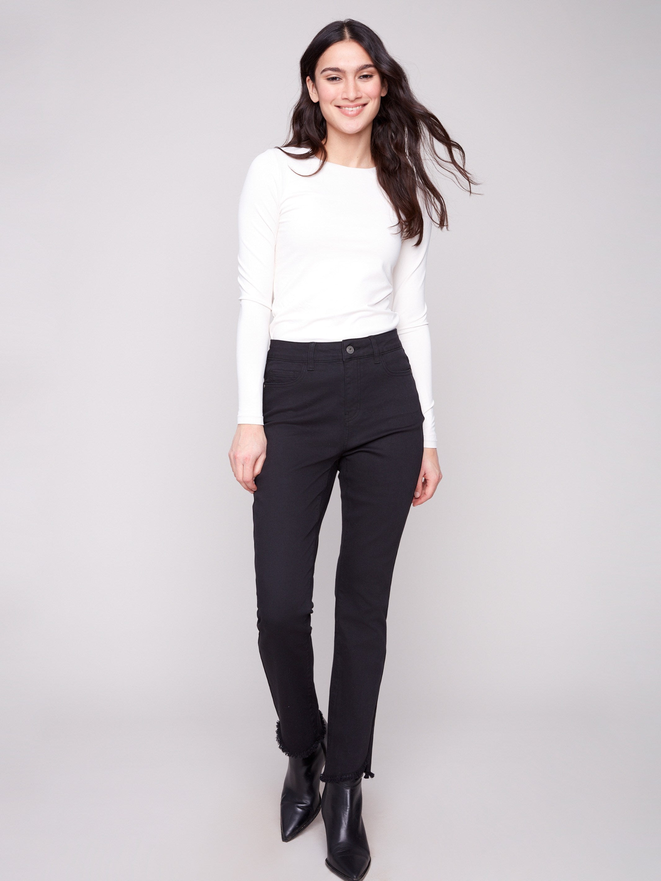 Black bootcut pants featuring a long length and stretch twill fabric for comfort and style by Charlie B.