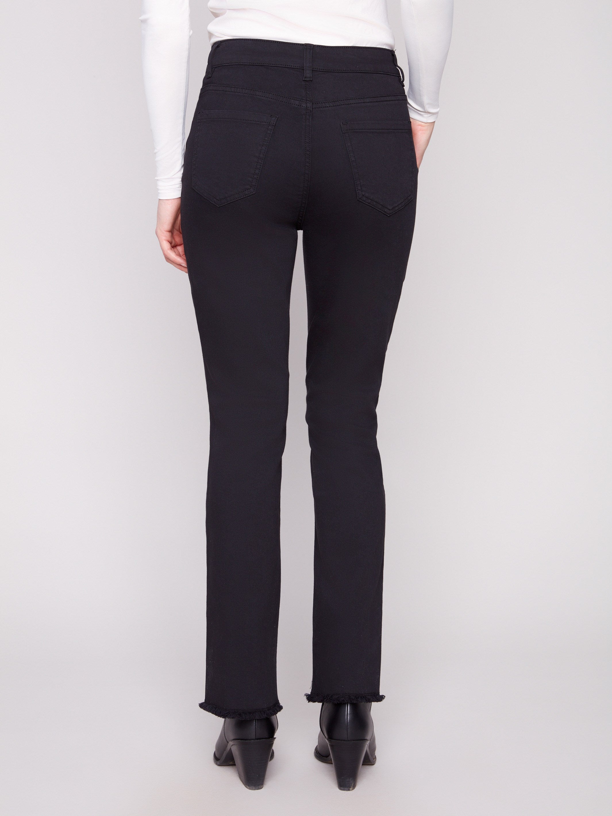 Comfortable black stretch twill pants with a regular rise and long length, perfect for versatile styling by Charlie B.