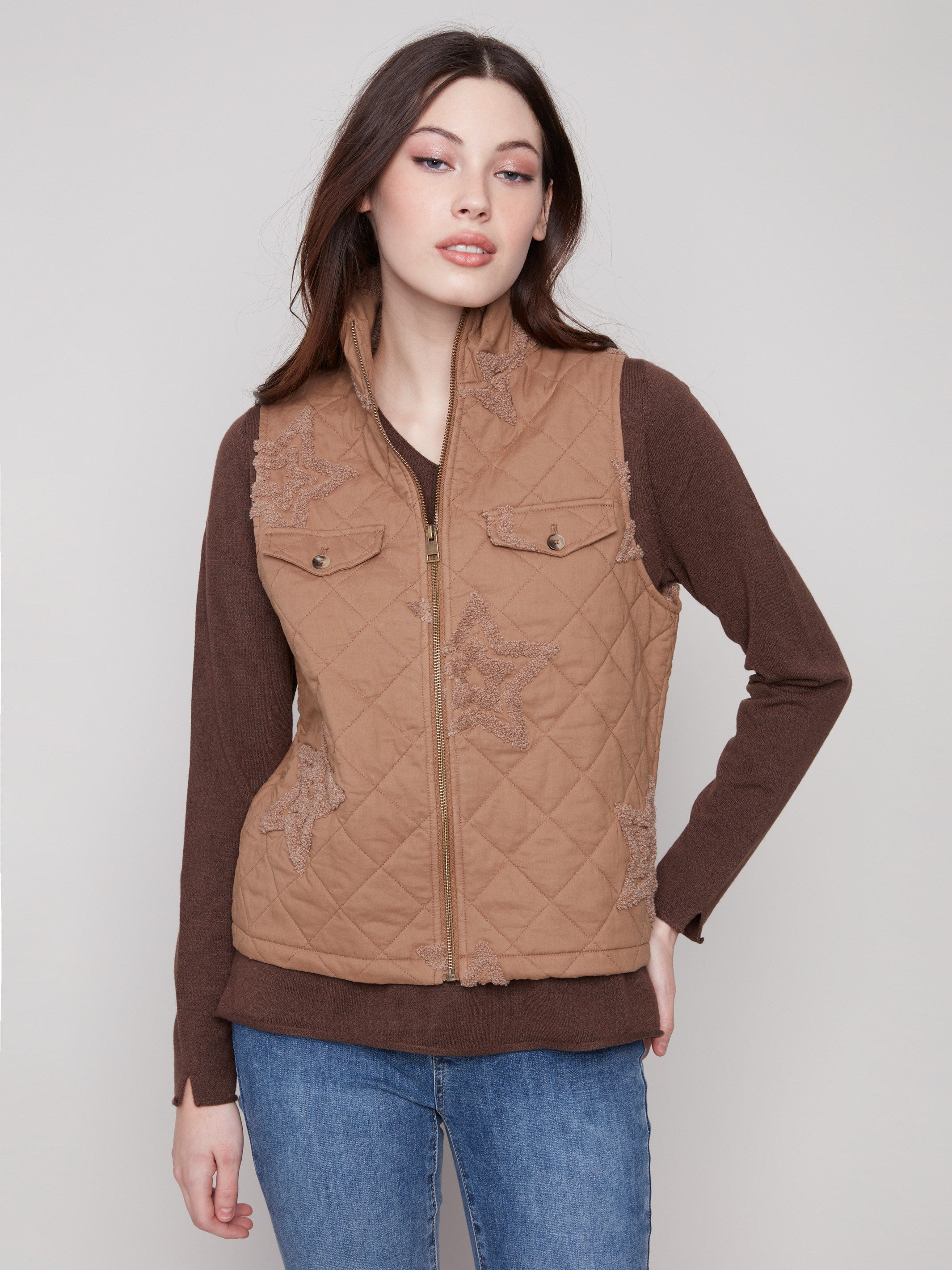 Khaki quilted vest featuring a stylish zip front closure and chic design details, perfect for layering by Charlie B.