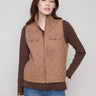 Khaki quilted vest featuring a stylish zip front closure and chic design details, perfect for layering by Charlie B.