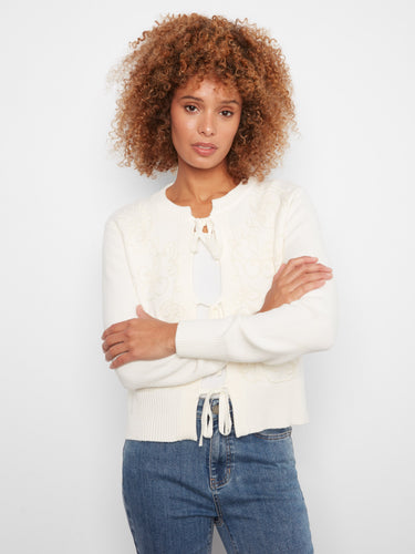 Soft jacquard knit cardigan in ecru, highlighted with a stylish crew neckline and bow tie accents by Charlie B.