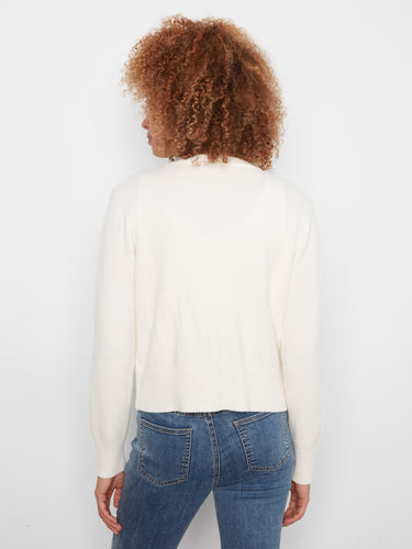 Ecru cardigan crafted from soft jacquard knit fabric, complete with ribbed cuffs and hem for added comfort by Charlie B.