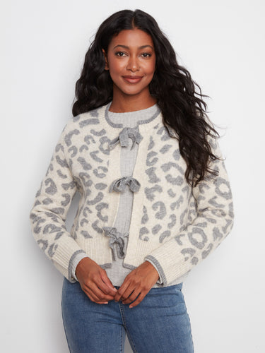 Stylish leopard print cardigan with ribbed hem details, offering both comfort and fashion flair. Crafted by Charlie B.