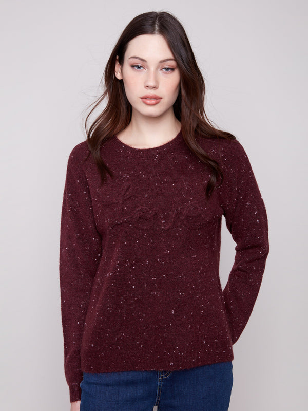Cabernet sweater with a classic crew neck and speckled pattern, featuring a cozy drop shoulder design by Charlie B.