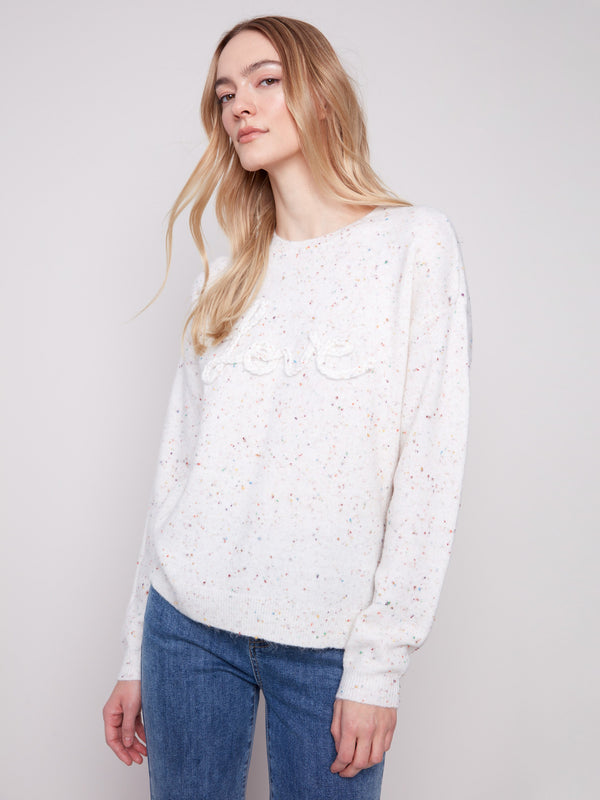 Stylish long sleeve sweater with a unique speckled pattern and drop shoulder style by Charlie B.