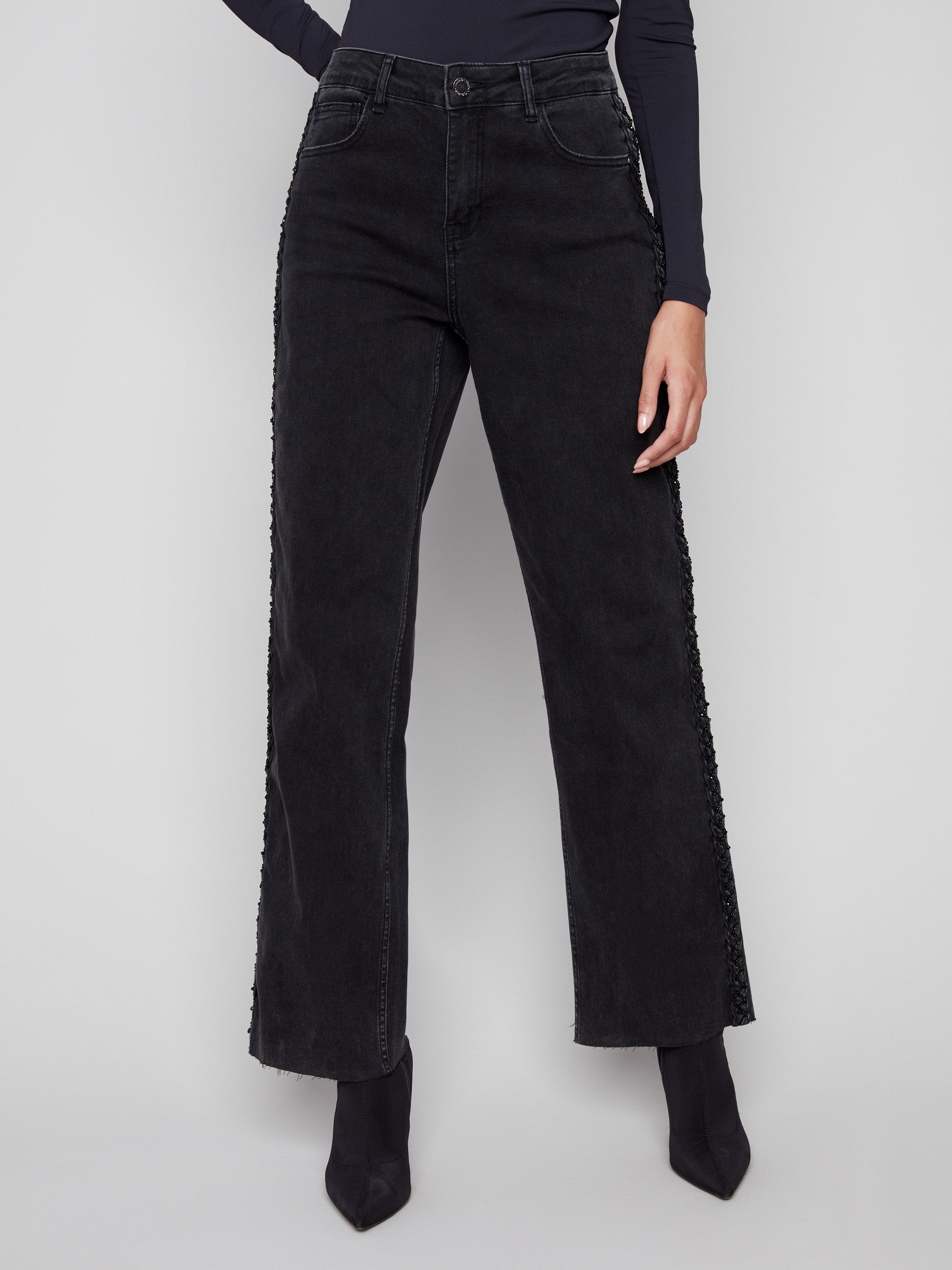 Designed with a straight fit, these charcoal jeans offer both comfort and elegance by Charlie B.