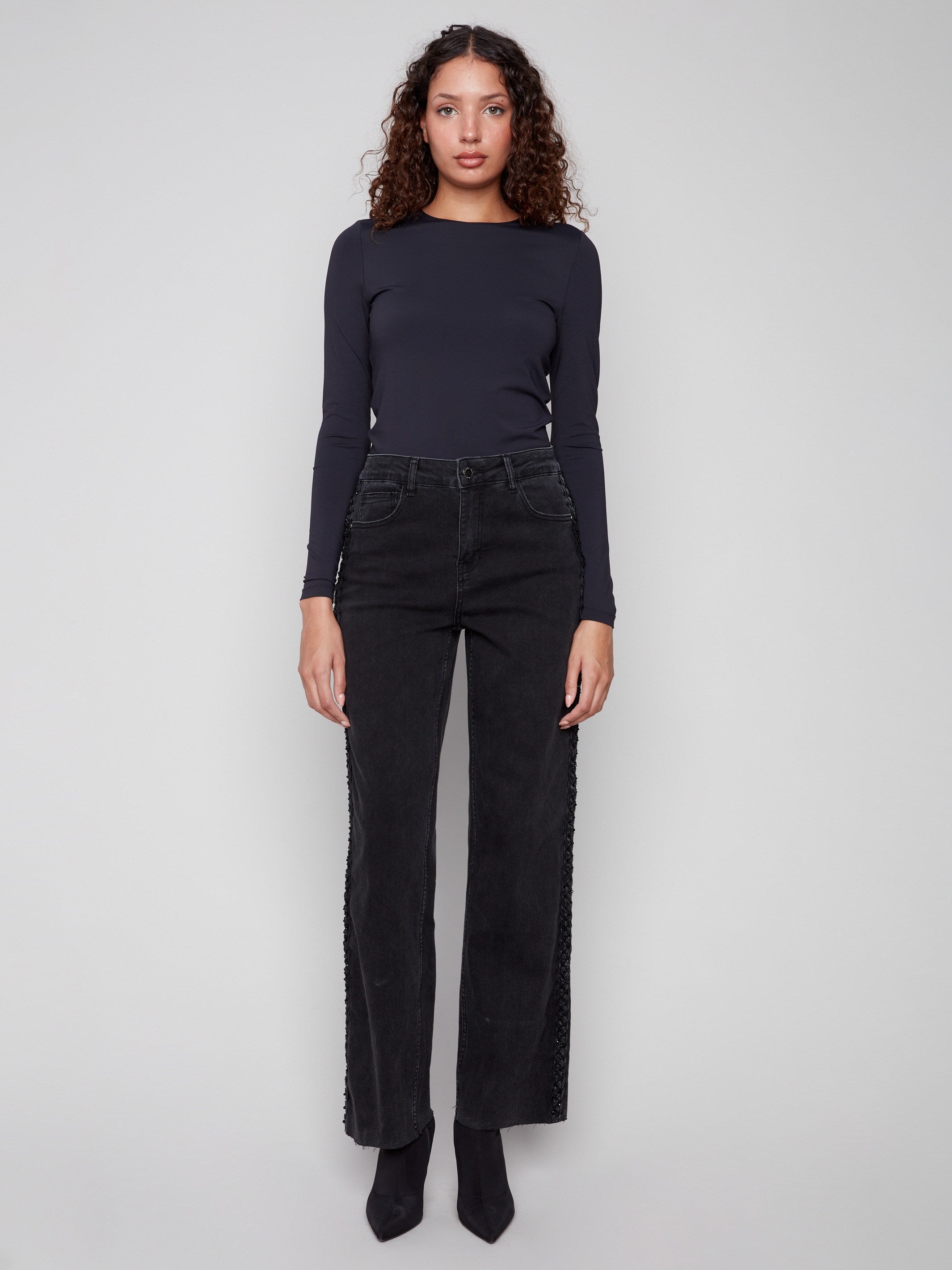 Featuring a five-pocket design, these charcoal jeans combine functionality with fashion by Charlie B.