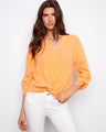 Orange top with a stylish notch neckline and front knot detail, crafted from 100% cotton for comfort and breathability by Charlie B.