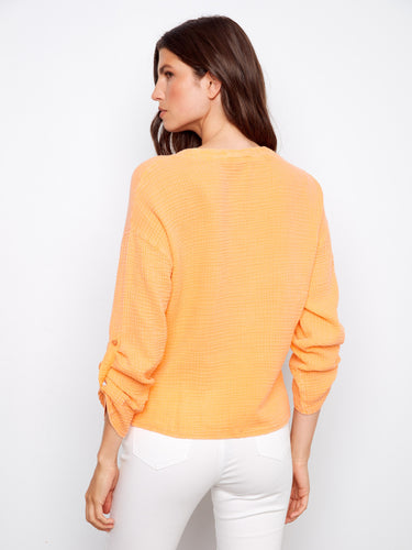 Soft and elegant orange top with long roll-up sleeves, offering a relaxed fit in premium 100% cotton by Charlie B.