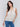 Chic and breathable sleeveless design in natural tones by Charlie B.