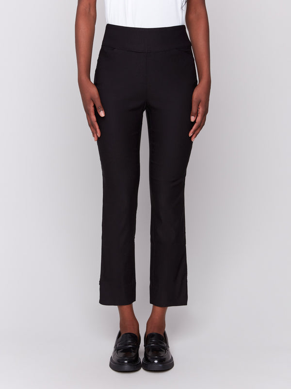 Black capri pants with hem slit and side pockets by Charlie B.