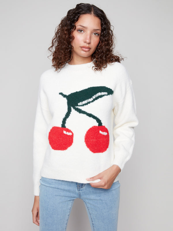 White sweater with cherry design featuring a classic crew neck, adding a playful touch to any outfit by Charlie B.