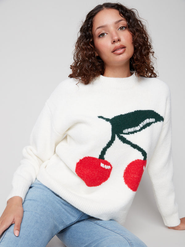 Intarsia sweater in white with cherries, showcasing its plush texture for ultimate comfort by Charlie B.