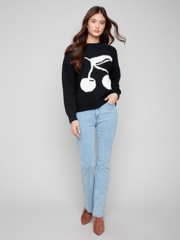 Stylish black sweater with plush texture and cherry intarsia for cozy elegance by Charlie B.