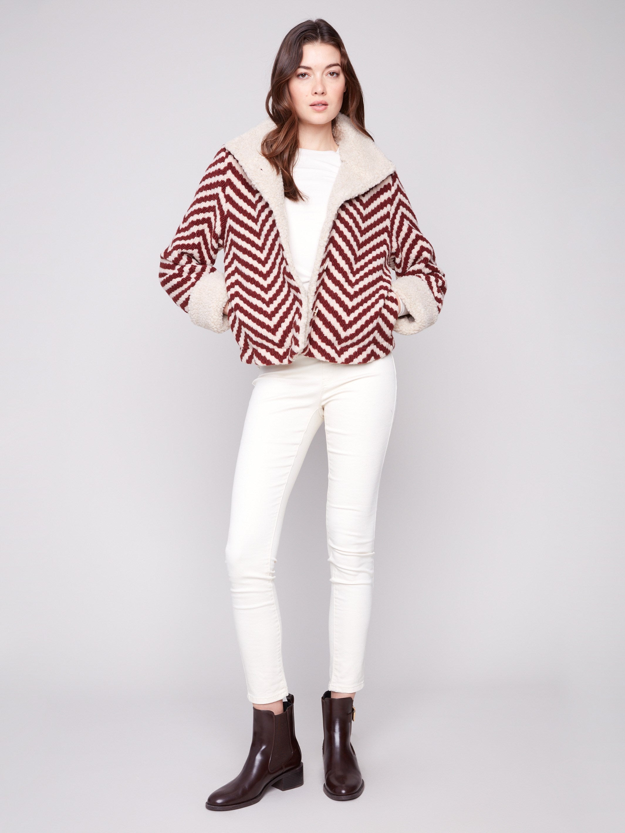 Chic Cabernet jacket with side pockets and boucle chevron pattern. Perfect blend of style and functionality by Charlie B.