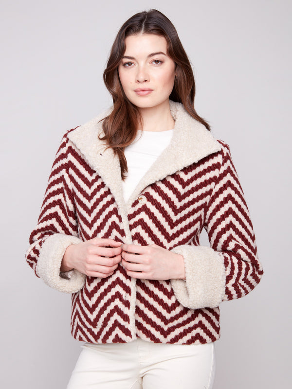Elegant Chevron Boucle Jacket with faux sherpa collar trim, providing both comfort and sophistication in one piece by Charlie B.