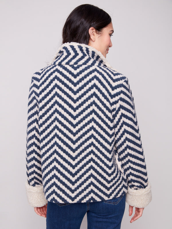 Chevron patterned jacket in boucle fabric with luxurious faux sherpa trim on collar and cuffs, offering warmth and style by Charlie B.
