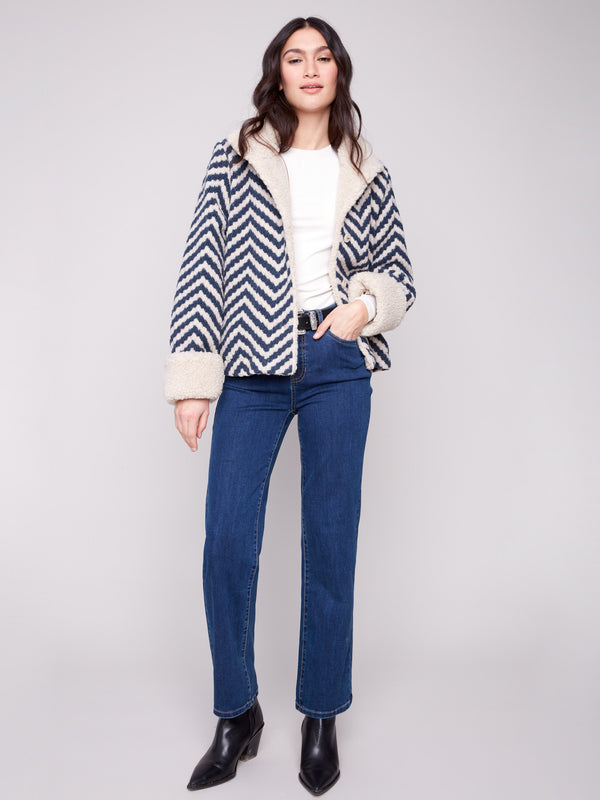 Stylish Navy Chevron Boucle Jacket with button closure for easy wear, complemented by its intricate chevron patterning by Charlie B.
