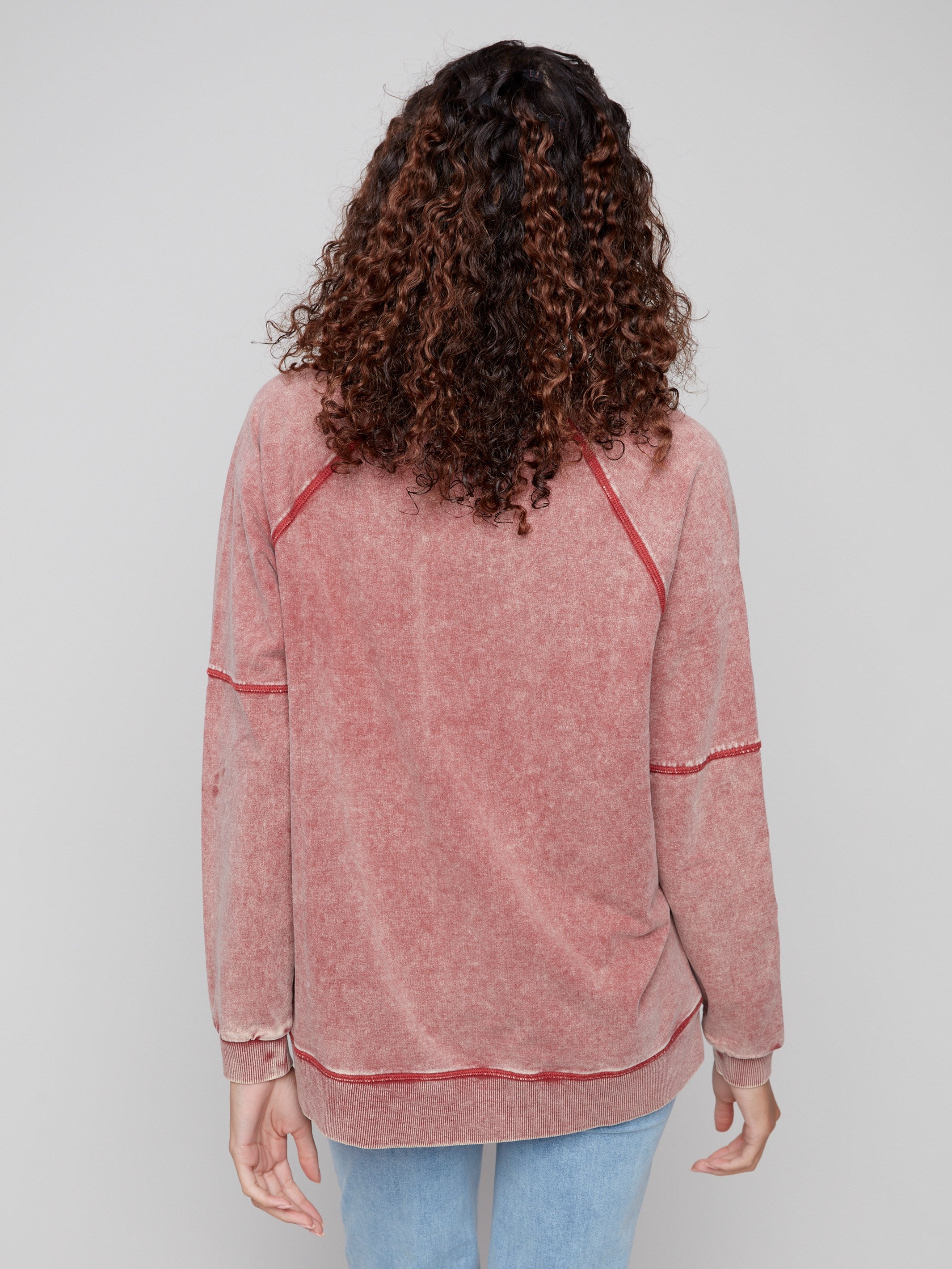 Featuring side slits, this Cabernet V-neck top combines style and ease for everyday wear by Charlie B.