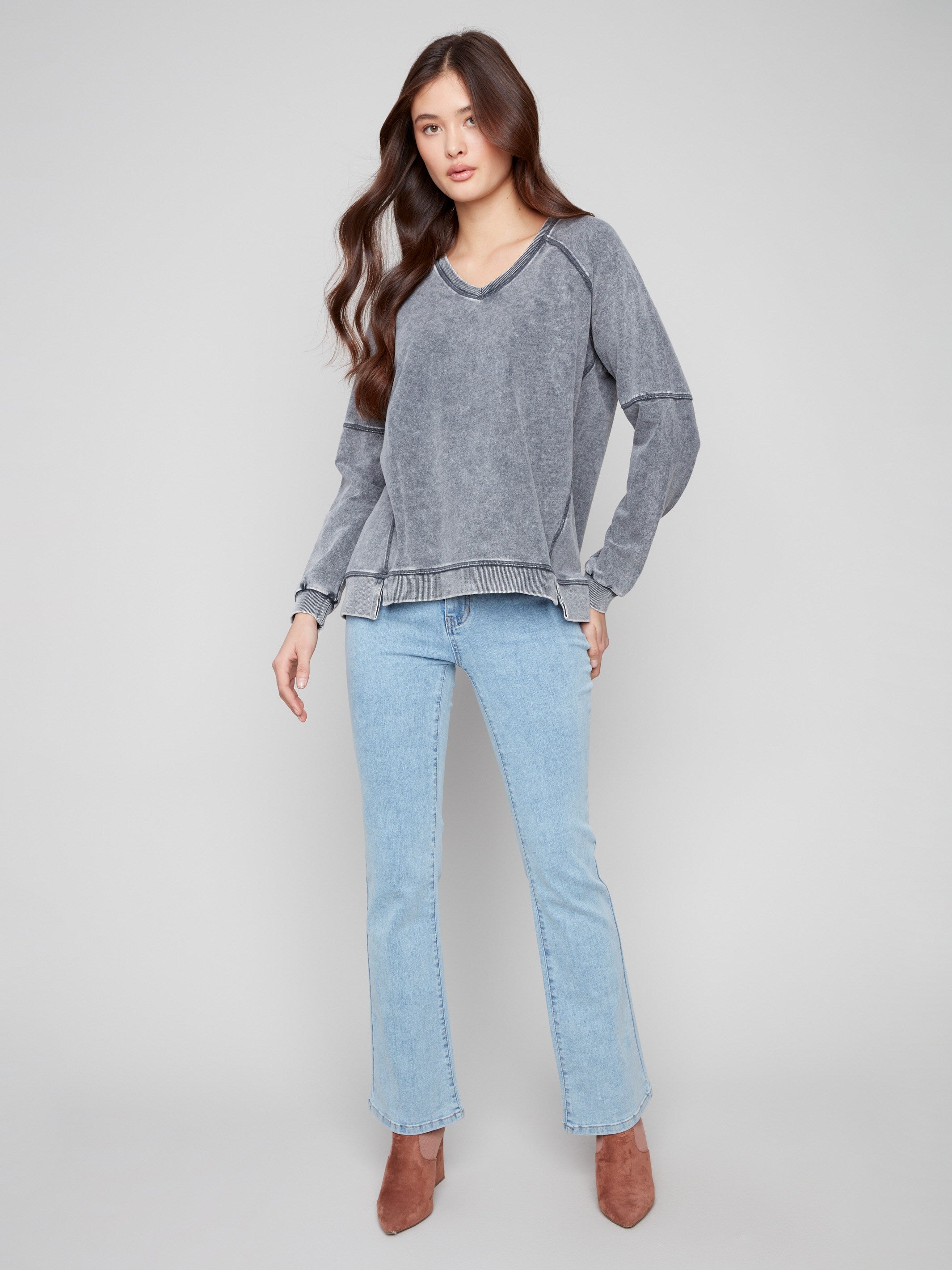 Charcoal V-neck top with washed effect, adding a unique texture and style to any casual ensemble by Charlie B.