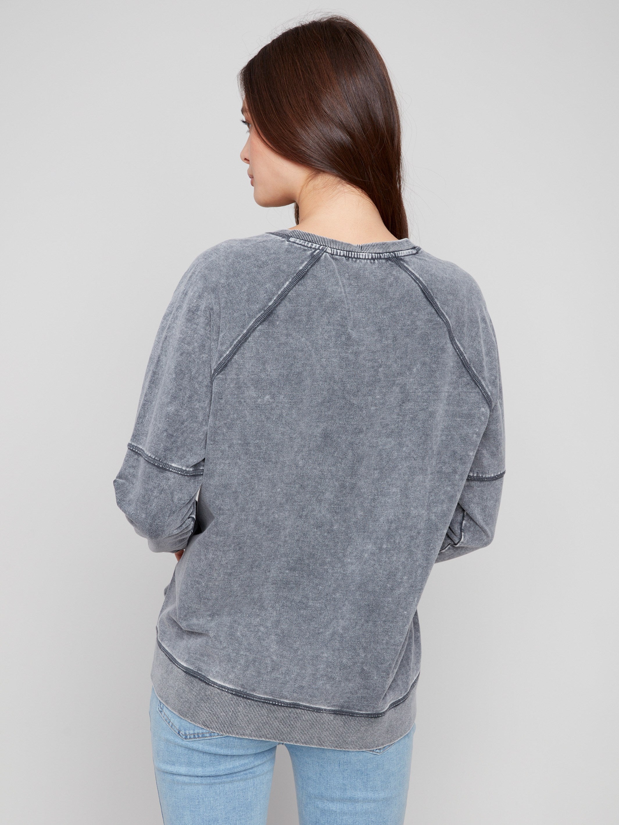 Charcoal V-neck top with side slits, enhancing movement and comfort while maintaining a chic appearance by Charlie B.