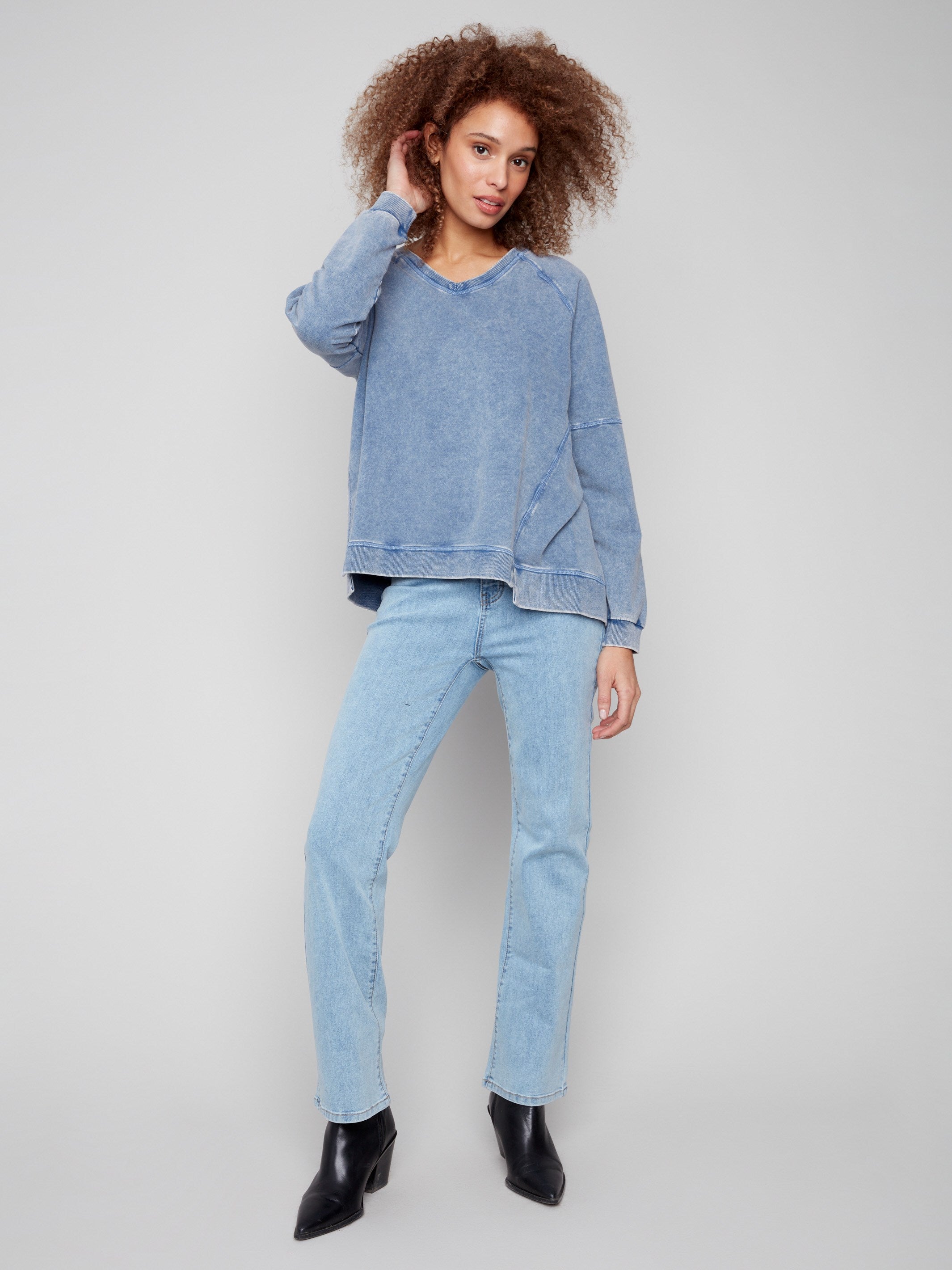 Stylish denim top with washed effect, adding a unique touch to your casual wardrobe by Charlie B.