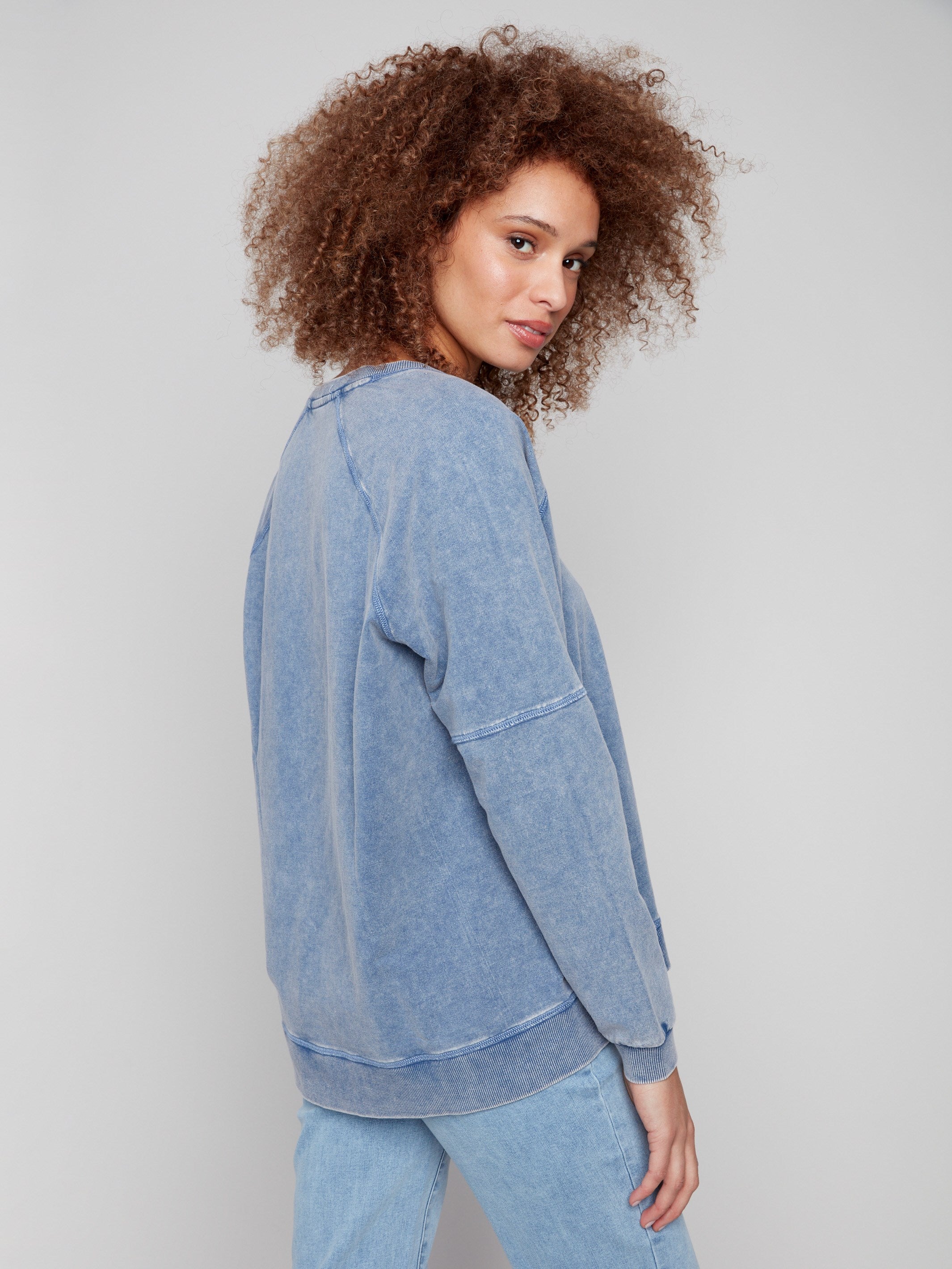 Comfortable denim top with side slits, offering ease of movement and style by Charlie B.