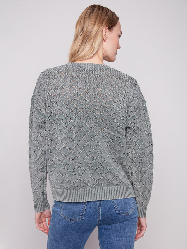 Stylish spruce sweater showcasing unique drop shoulders and a delicate pointelle knit texture by Charlie B.