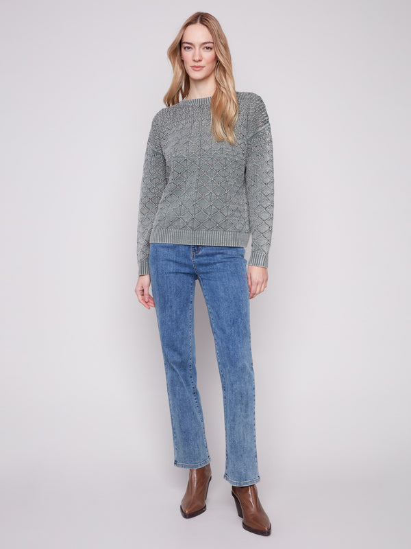 Versatile pointelle sweater in spruce with a timeless crew neck, crafted for both comfort and elegance by Charlie B.