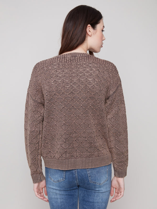 Elegant pointelle design in mocha adds texture and sophistication to this cozy long-sleeve sweater by Charlie B.