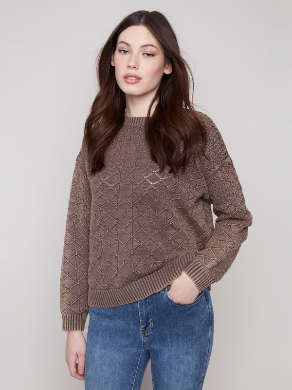 Featuring a classic crew neck, this mocha pointelle sweater is both comfortable and stylish for everyday wear by Charlie B.