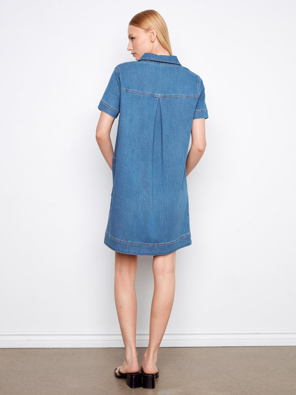 Elegant and timeless, this knee-length denim dress is a wardrobe staple with its classic design. By Charlie B.