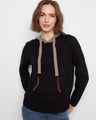 Black sweater with a kangaroo pocket and vibrant contrast stitching on the pocket edges by Charlie B.