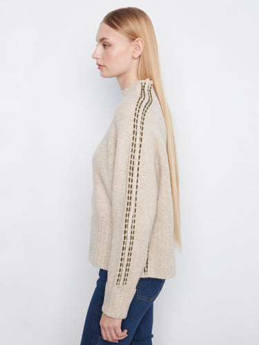 The contrast stitching details add a unique touch to this chic sweater design. Crafted thoughtfully by Charlie B.