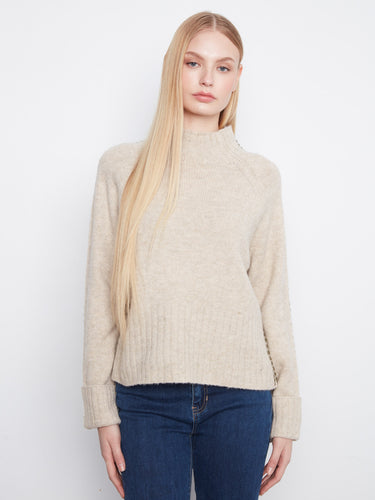 Cozy knitwear featuring cuffed sleeves and a relaxed fit, great addition to any wardrobe. By Charlie B.