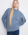 Cozy sweater featuring a mock neck design, perfect for chilly days. Styled by Charlie B.
