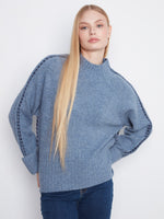 Cozy sweater featuring a mock neck design, perfect for chilly days. Styled by Charlie B.