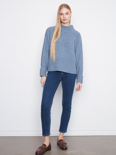 Elegant long raglan sleeves add a touch of sophistication to this cozy sweater. Styled by Charlie B.