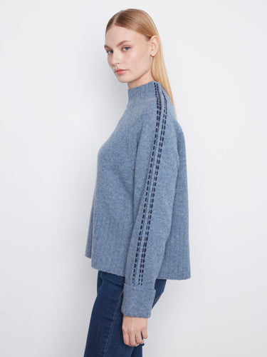 Chic contrast stitching details enhance the texture and style of this comfortable sweater. By Charlie B.