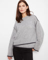 Gray sweater featuring a crew neckline and drop shoulders, offering a relaxed fit with contrast trim for added style by Charlie B.