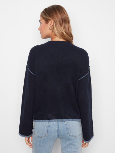 Comfortable navy sweater highlighted by its wide sleeves, providing both style and ease of movement for any occasion by Charlie B.