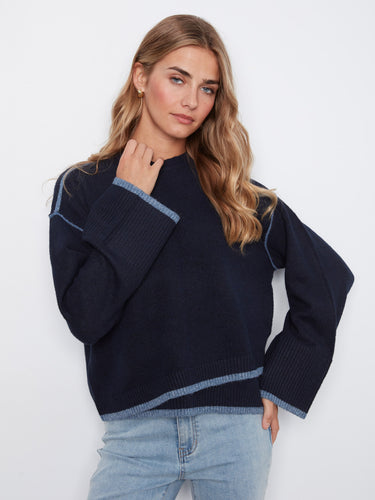 Stylish navy sweater designed with drop shoulders and contrast trim, perfect for creating effortless chic looks by Charlie B.
