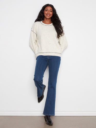 Whipstitch detailing adds a unique touch to this sweater, making it stand out in any wardrobe. Pair with jeans for effortless style by Charlie B.