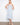 Light blue floral pattern dress with midi length, perfect for versatile styling. Features a unique removable strap by Charlie B.