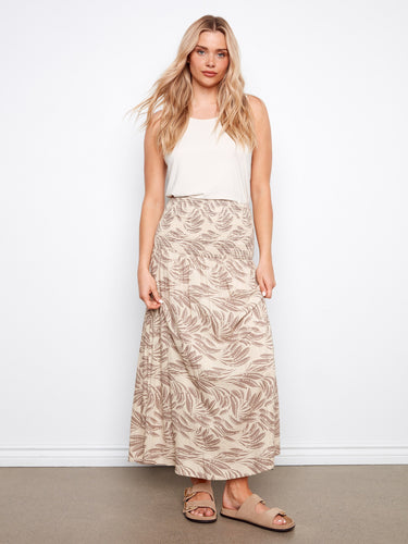 This versatile outfit features removable straps, allowing it to be worn as a stylish midi dress. By Charlie B.