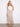 Experience the comfort and elegance of this midi length piece with its adaptable style options. By Charlie B.