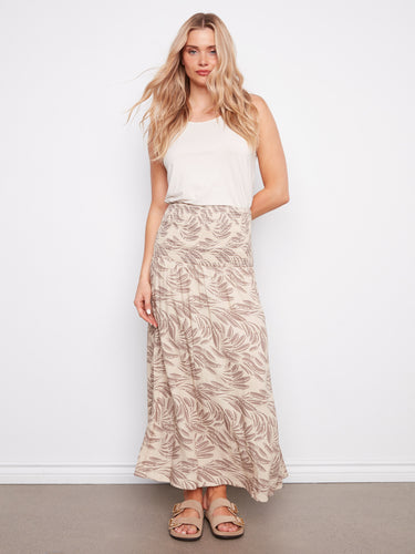 Experience the comfort and elegance of this midi length piece with its adaptable style options. By Charlie B.