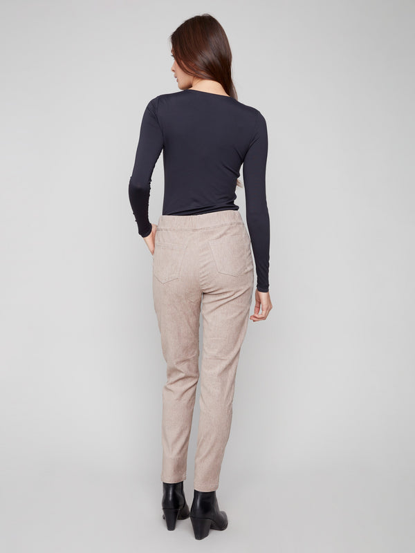 Stylish almond joggers with pull-on style and two back pockets, crafted from soft corduroy fabric for ease by Charlie B.