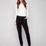 Black corduroy jogger pants featuring a slim fit and elastic waistband with drawstrings for comfort by Charlie B.