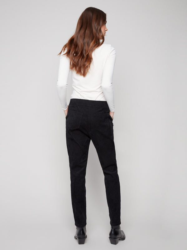 Versatile black jogger pants highlighting an elastic waistband and mid-rise design for everyday wear by Charlie B.